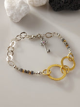 Load image into Gallery viewer, Gold, Silver, Brass, Glass, Crystal and Hematite bracelet.