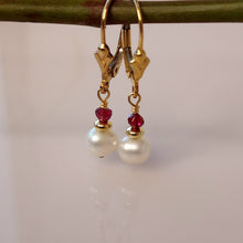 Load image into Gallery viewer, One inch, handcrafted, Garnet, Pearl and Gold stacked beads are hand wire-wrapped to 14 karat gold-filled lever back closures.