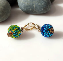 Load image into Gallery viewer, A pair of drop earrings with textured, beaded spherical beads multicolored, connected by a gold-tone metal chain link and 14 karat Gold-filled leverbacks.
