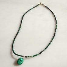 Load image into Gallery viewer, A Malachitel beaded necklace with a textured natural 1turquoise green-blue gemstone pendant. Sterling Silver findings.