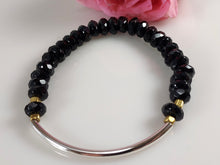Load image into Gallery viewer, Stretch bracelet with Faceted Black Onyz, Sterling Silver and a splash of Brass.
