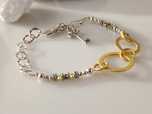 Mixed metals bracelet bykatejewelry designs.