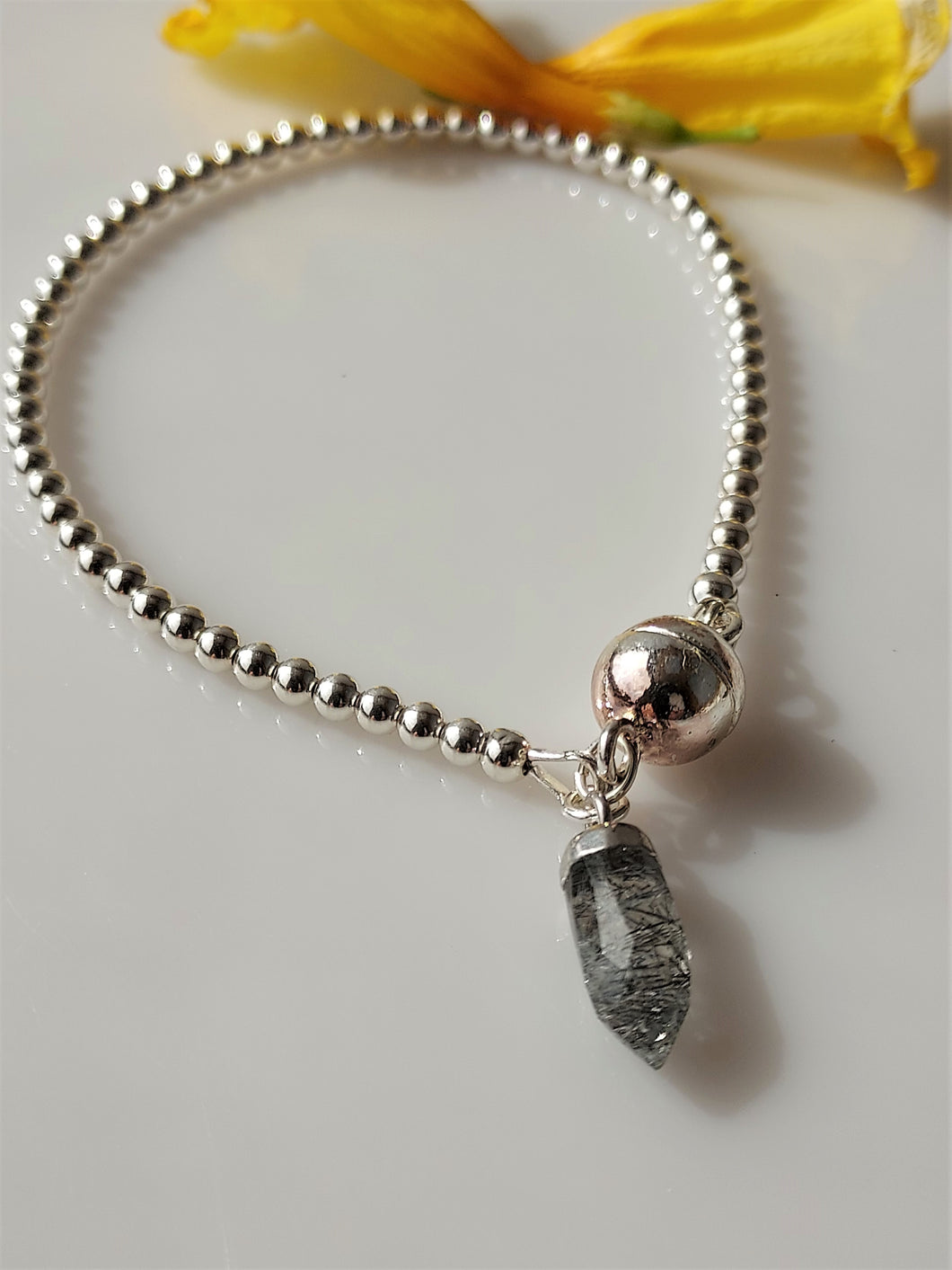 Sterling silver bracelet with magnetic clasp.