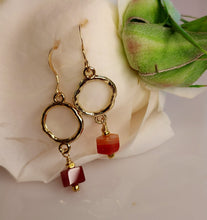 Load image into Gallery viewer, Carnelian and gold-plated round links and hand wire wrapped together and are suspended for m 14 karat gold filled ear wires.
