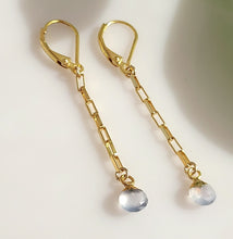 Load image into Gallery viewer, A pair of gold drop earrings with 14-karat Gold-filled findings, leverback closures, paperclip-style chain links, and small faceted, teardrop shaped, gold-leafed Calcedony gemstone dangles, photographed on a plain light background.
