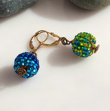 Load image into Gallery viewer, A pair of drop earrings with textured, beaded spherical beads multicolored, connected by a gold-tone metal chain link and 14 karat Gold-filled leverbacks.
