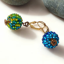 Load image into Gallery viewer, A pair of drop earrings with textured, beaded spherical beads multicolored, connected by a gold-tone metal chain link and 14 karat Gold-filled leverbacks.
