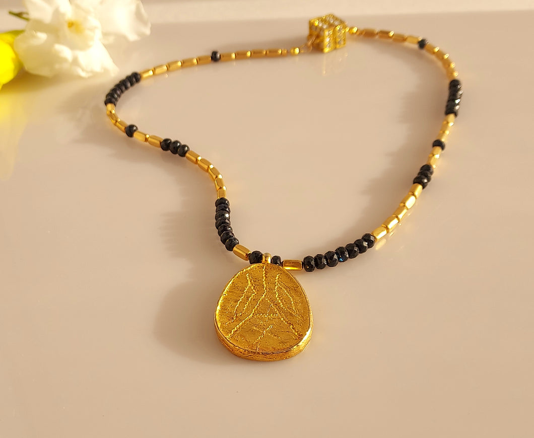18 Karat gold plated beads and pendant with ble Sapphire necklace.