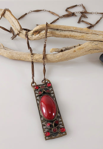 Brass and red Cabochon 36 inch necklace.