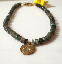 Load image into Gallery viewer, Labradorite beaded necklace featuring dark green, blue and gray labradorite stones with a 1handmade and kiln fired Bronze circular medallion pendant. 14 karat gold-filled toggle clasp.
