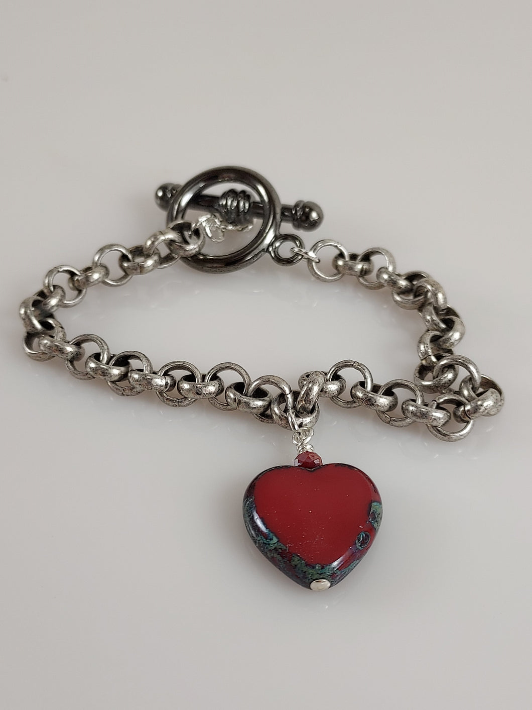 Silver chain and heart bracelet handcrafted in California.